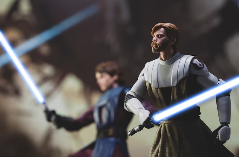 Jedi General Obi Wan Kenobi and Anakin Skywalker with lightsabers in battle