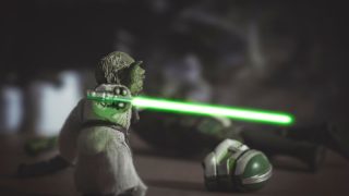 Jedi Master Yoda kills a robot