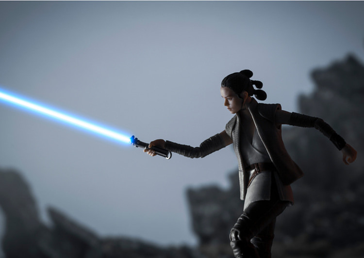 Rey Skywalker with her lightsaber