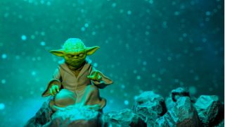 Yoda meditating in snow falling sky