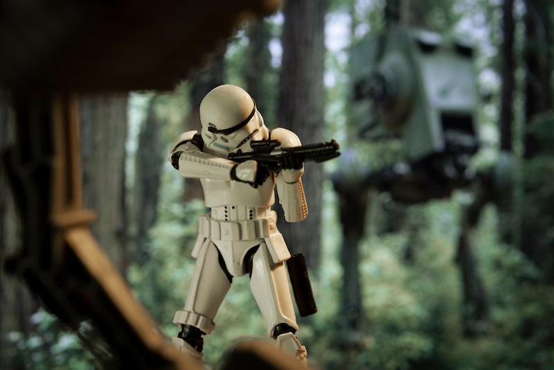 a trooper is using a blaster in a combat
