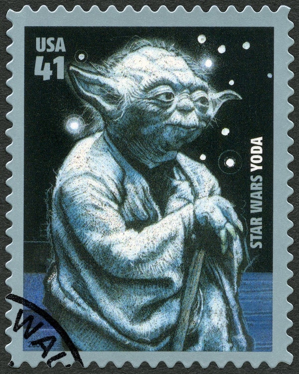 old yoda printed on a stamp