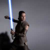 rey with a blue lightsaber