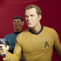 Captain Kirk and Mr Spock with a phaser