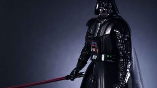 Darth Vader in a heavy armour is holding his lightsaber