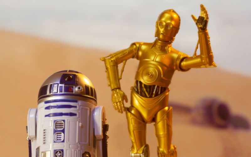 the two droids C-3PO and R2-D2 on the desert planet of Tatooine