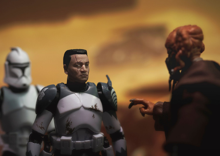 Clone Commander Wolffe is talking to Jedi Master Plo Koon