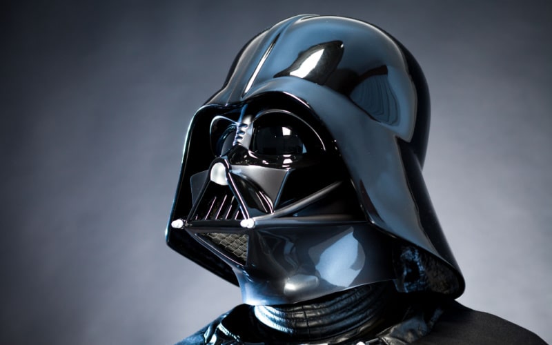 The Sith Lord Darth Vader in a close up view with his helmet