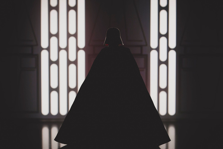 Star Wars Sith Lord Darth Vader appears in a dark background