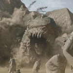 A leviathan krayt dragon erupts from the sand on Tatooine