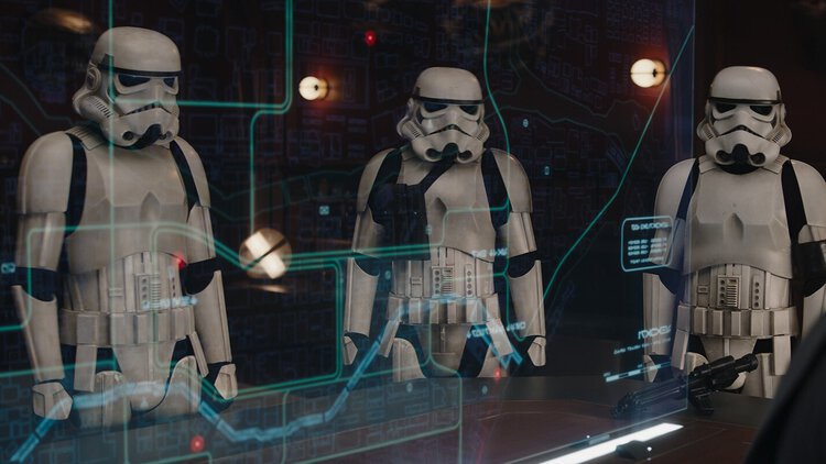 Three Imperial stormtroopers wearing standard white armor