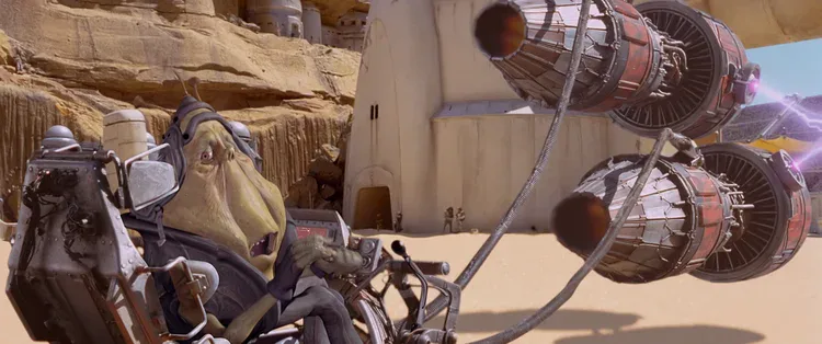 Ben Quadinaros struggles with the controls beside his podracer engines.
