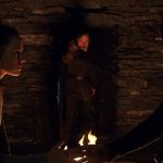Rey and Kylo Ren touching hands through their Force connection