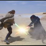 Qui-Gon Jinn and Darth Maul cross lightsabers in the Tatooine desert.